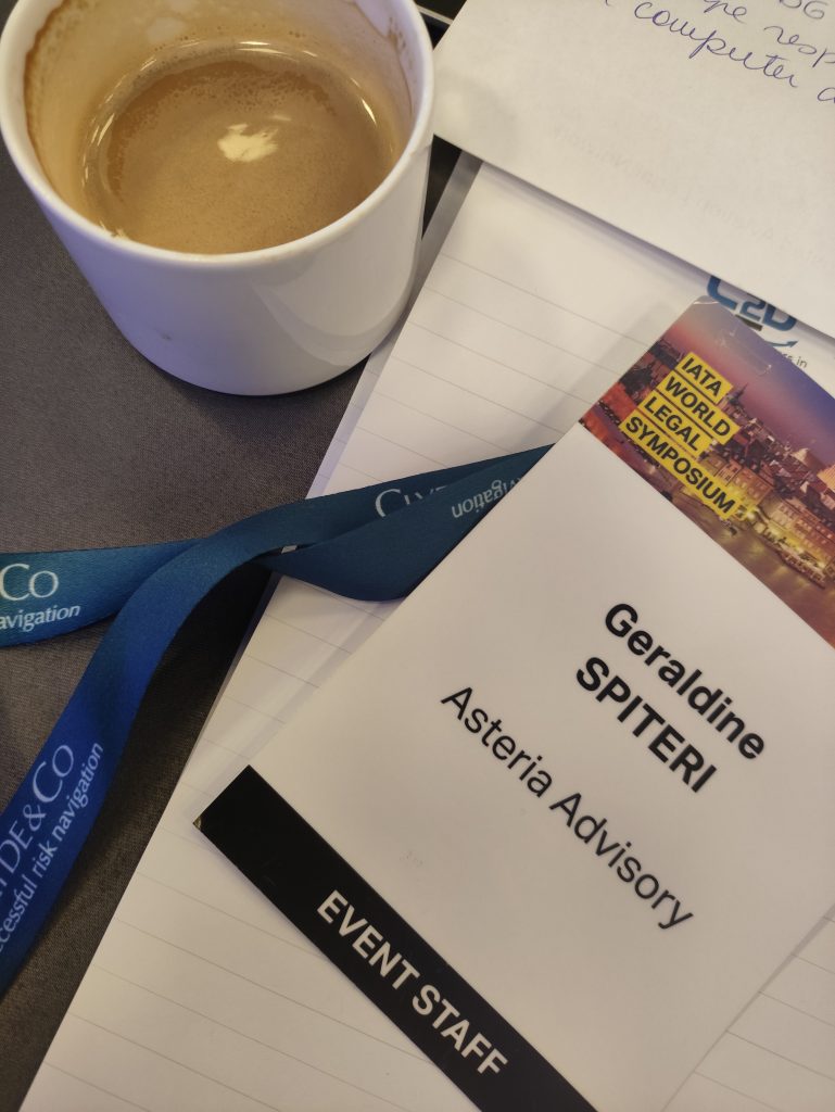 Coffee cup and Asteria Advisory's Staff Tag at IATA WLS 2026